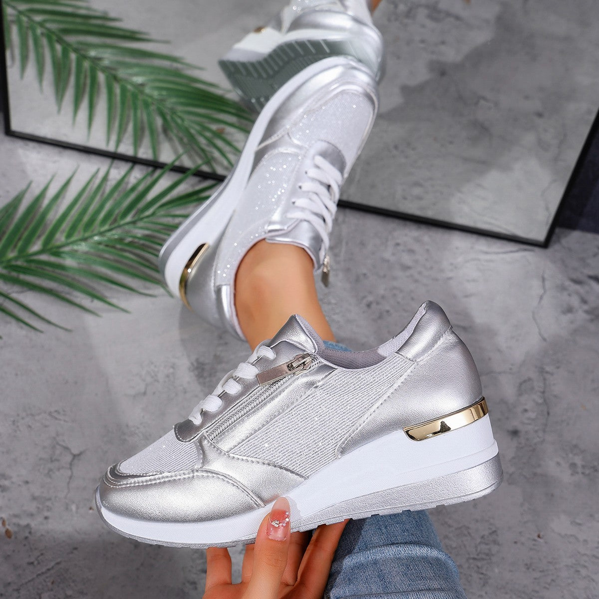 Women’s lace-up sneakers with side zipper and thick sole, casual sports style.