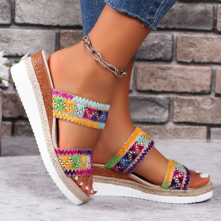 Women’s woven wavy-pattern wedge sandals with wide strap, ethnic summer style.