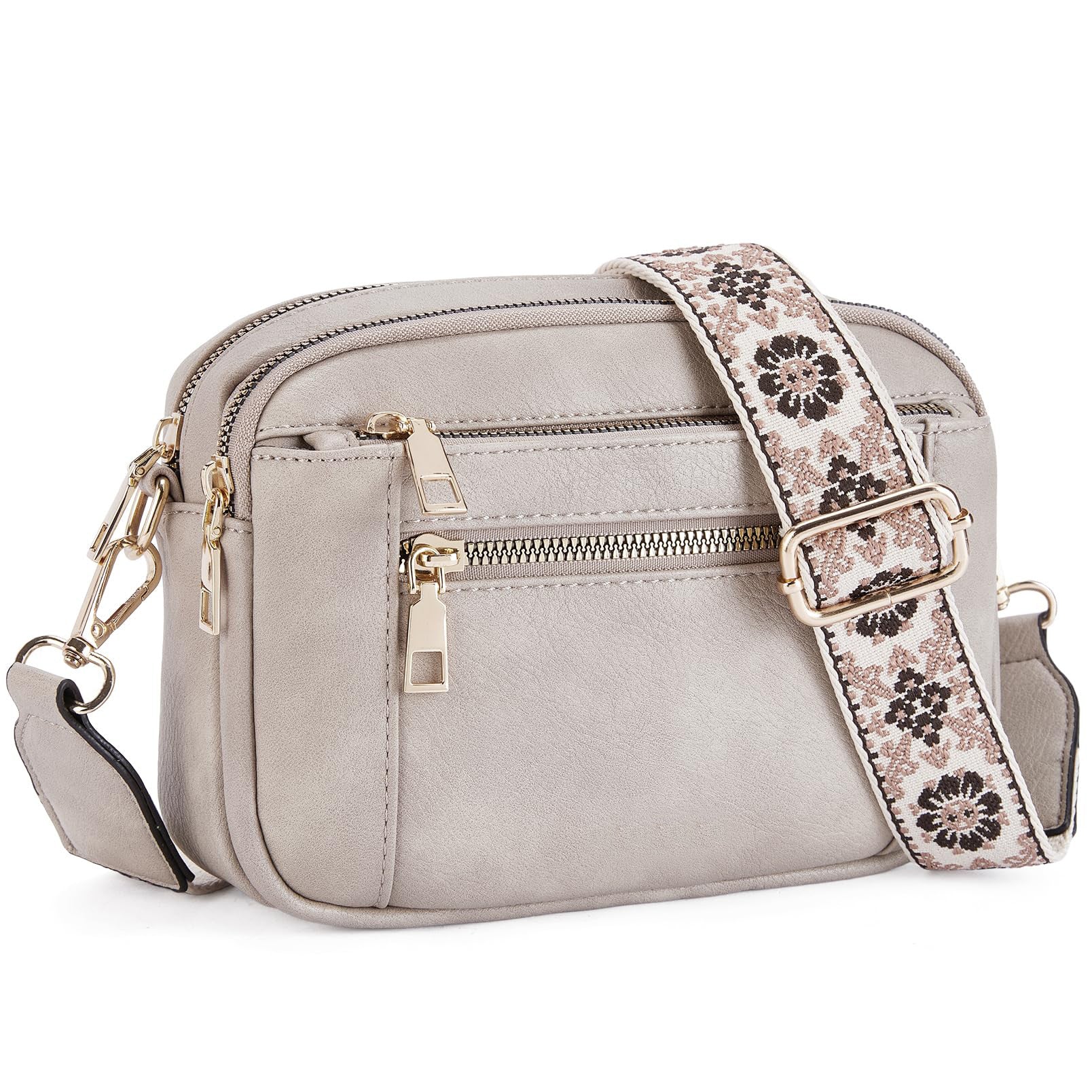 Women’s triple-zip colorblock crossbody bag with embroidered strap.