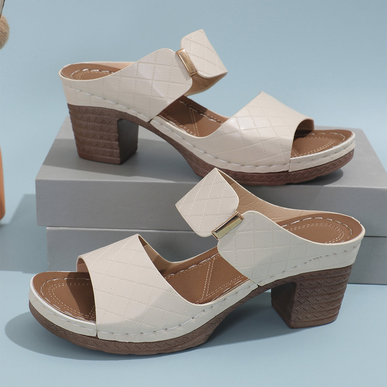 Women’s plaid chunky-heel slide sandals with round toe, stylish summer wear.
