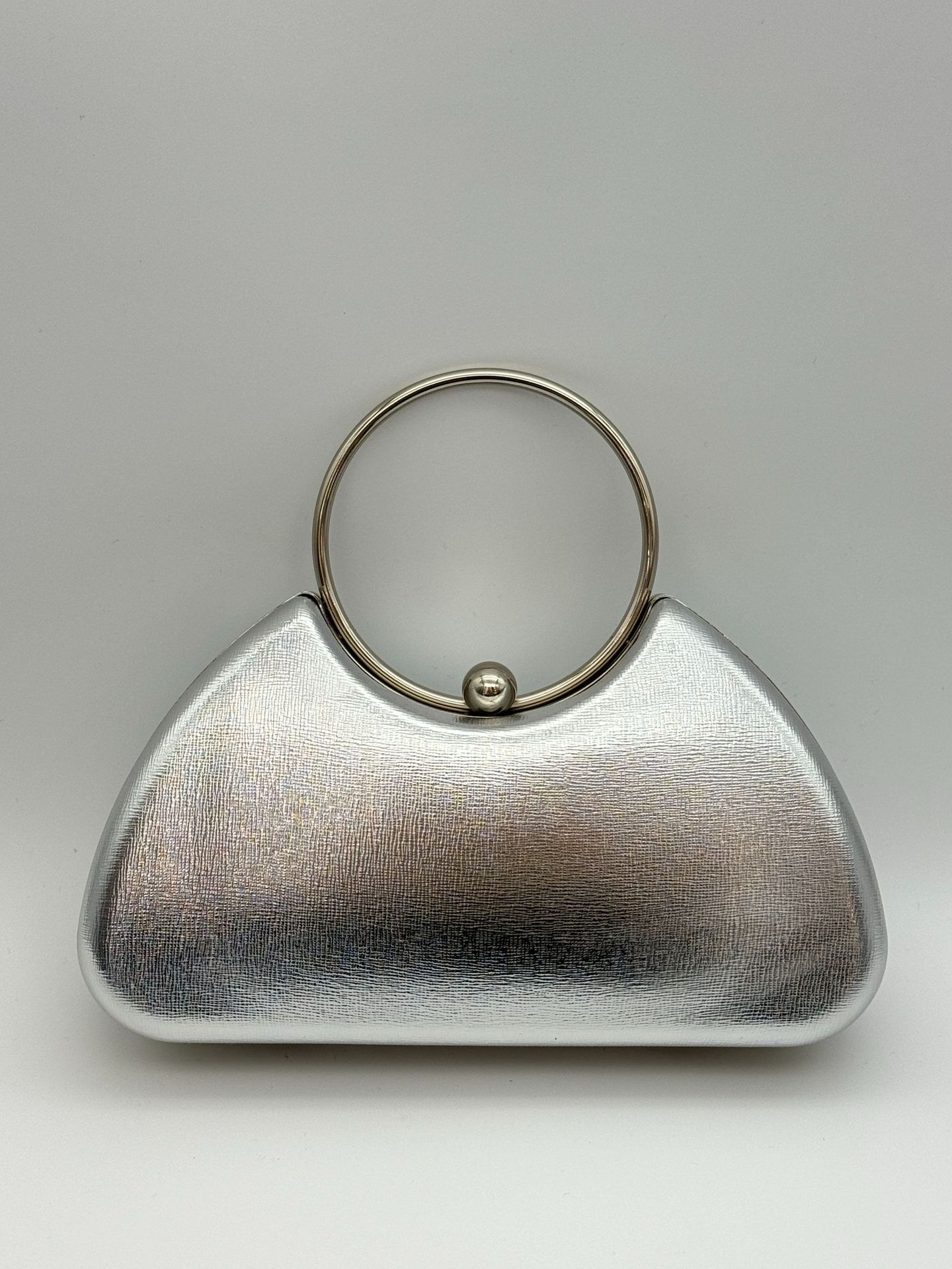 Women’s minimalist metal-frame evening clutch, perfect for parties.