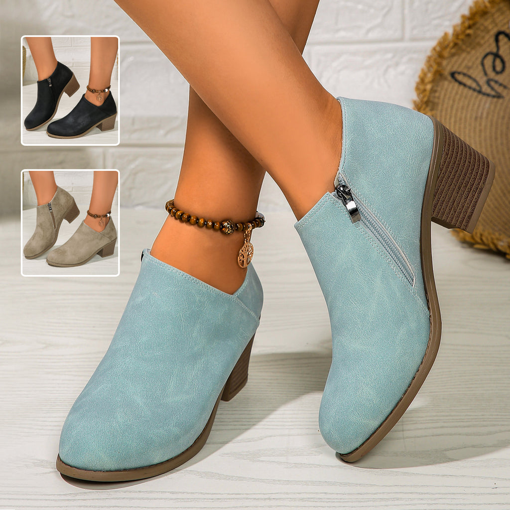 Women’s chunky-heel round-toe ankle boots with side zipper.