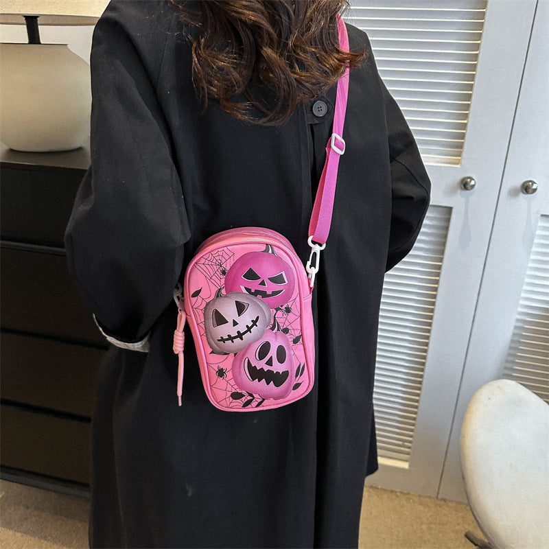 Mini Halloween cartoon crossbody bag with pumpkin, ghost, and bat print.