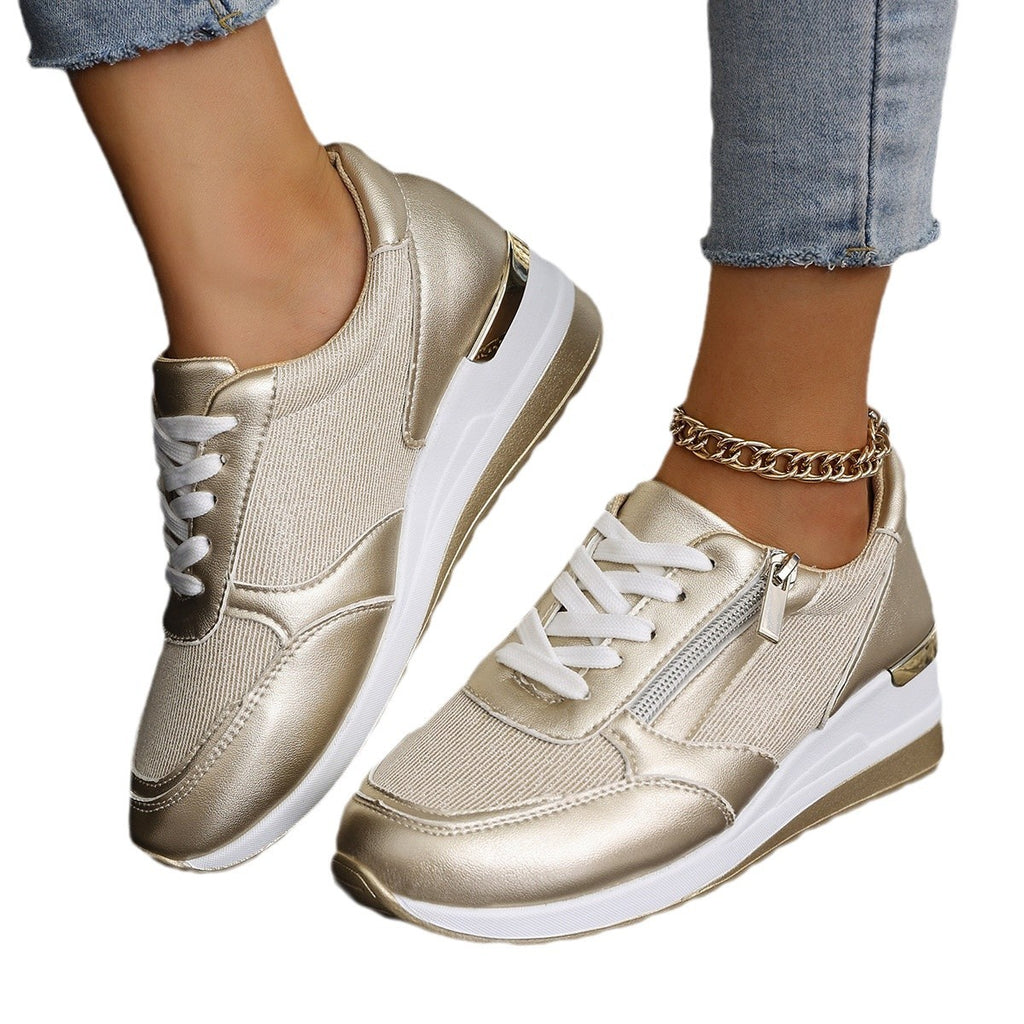 Women’s lace-up sneakers with side zipper and thick sole, casual sports style.