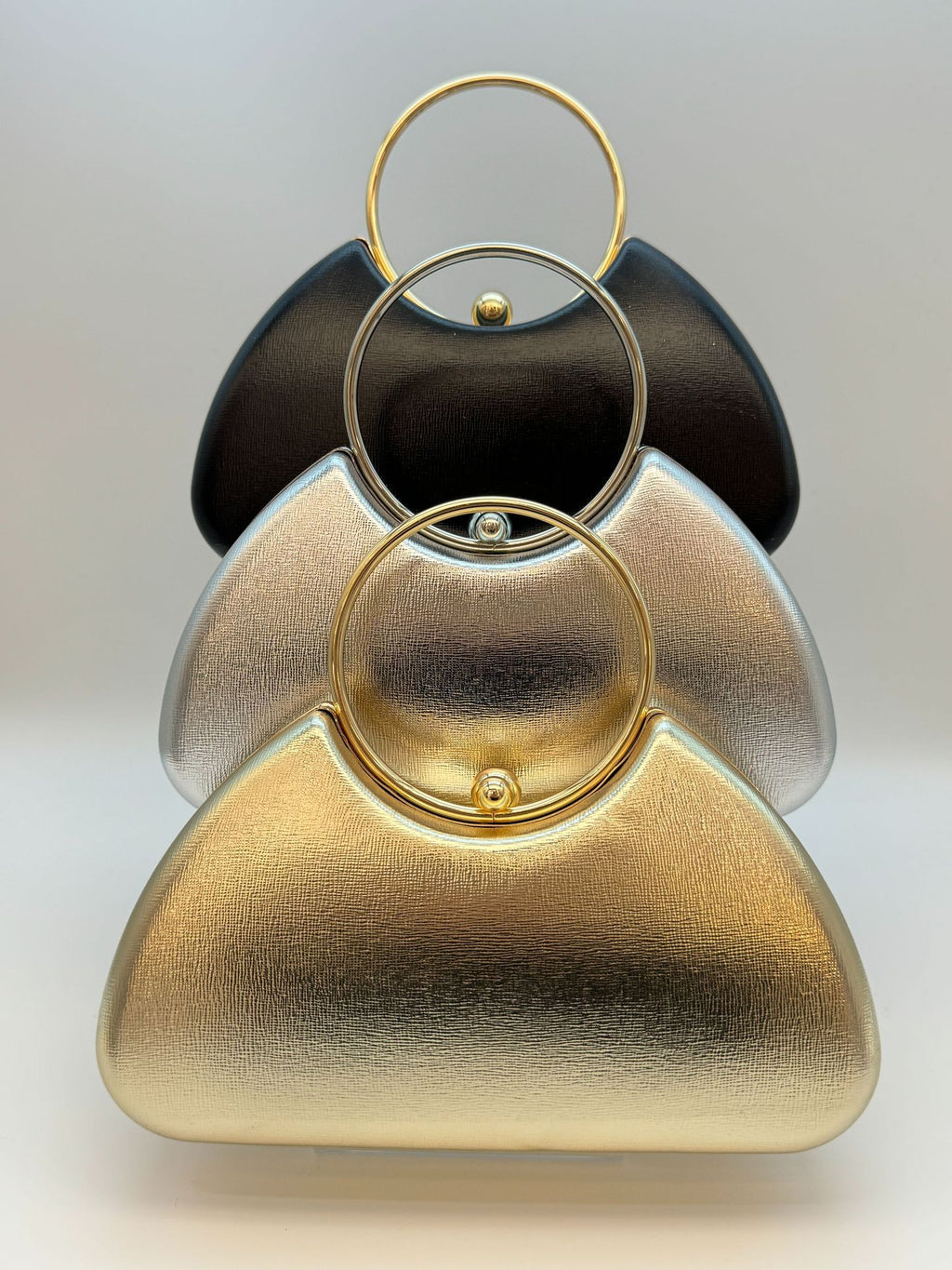 Women’s minimalist metal-frame evening clutch, perfect for parties.