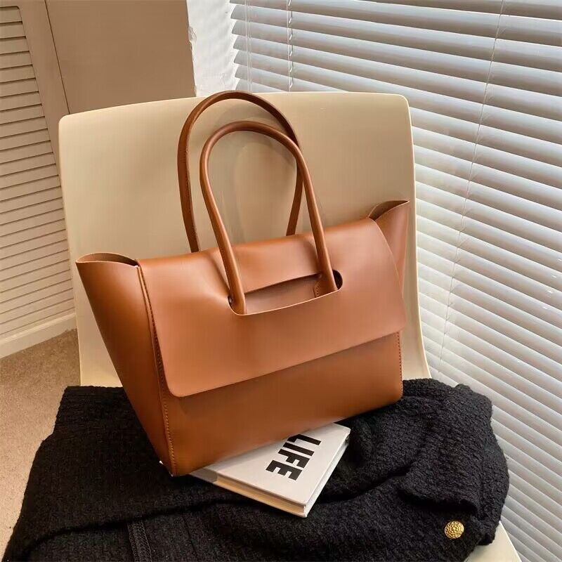 Women’s large retro tote handbag, simple solid-color design.