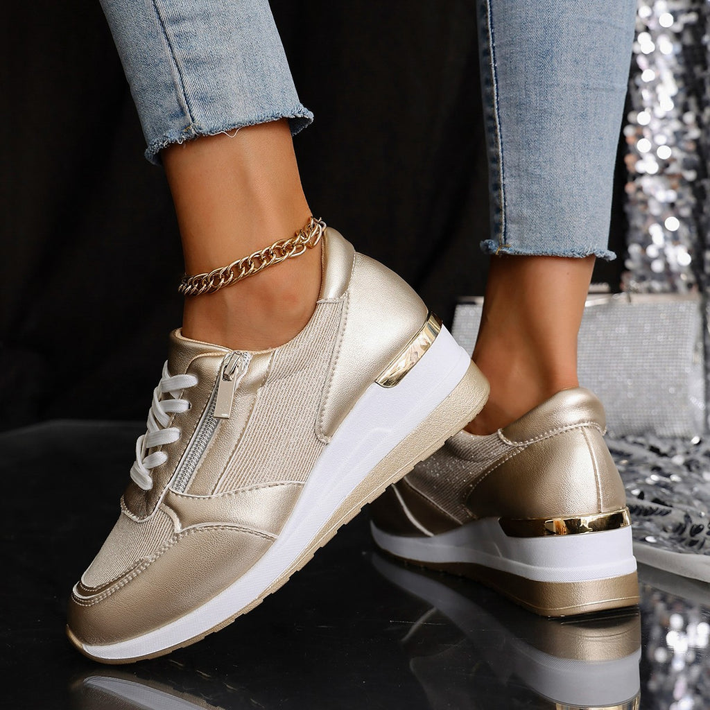Women’s lace-up sneakers with side zipper and thick sole, casual sports style.