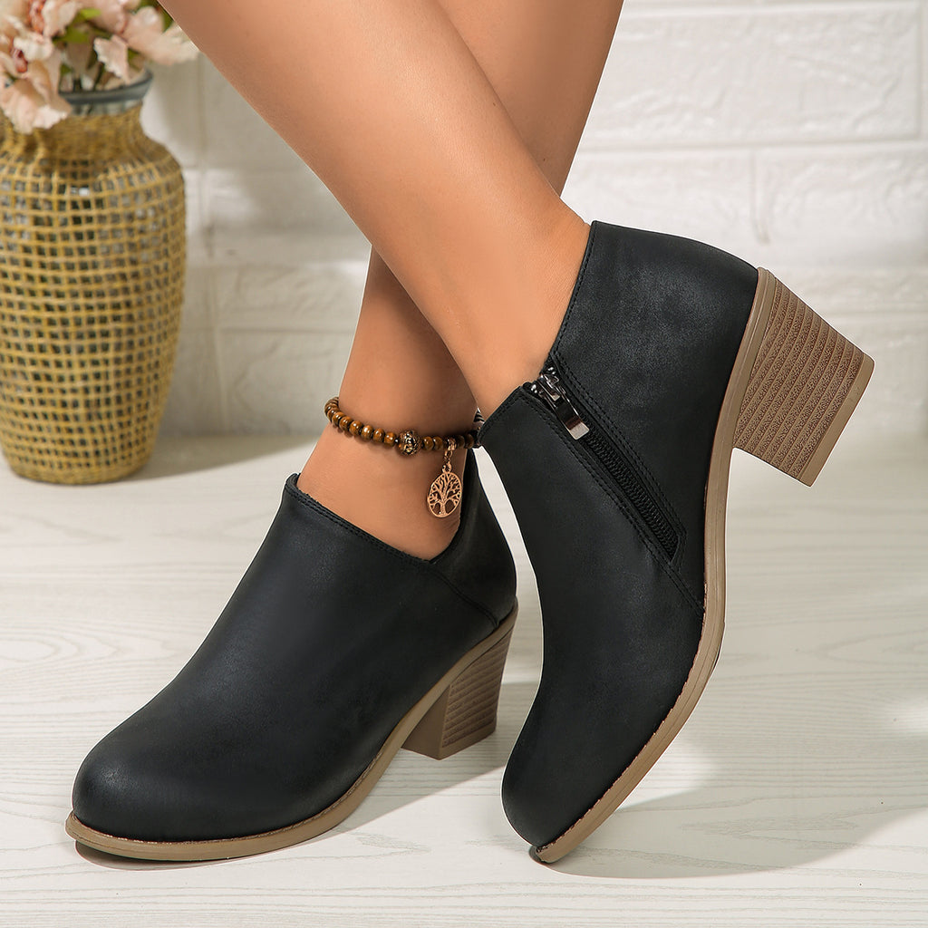 Women’s chunky-heel round-toe ankle boots with side zipper.