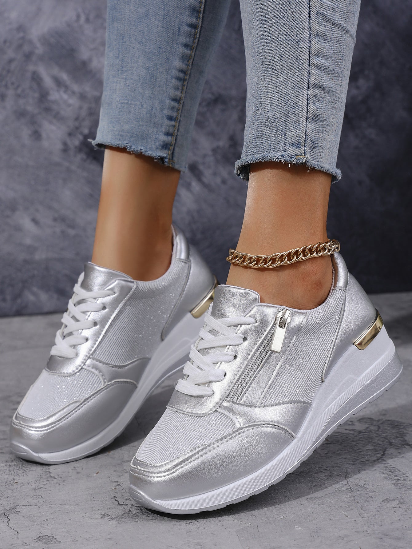 Women’s lace-up sneakers with side zipper and thick sole, casual sports style.