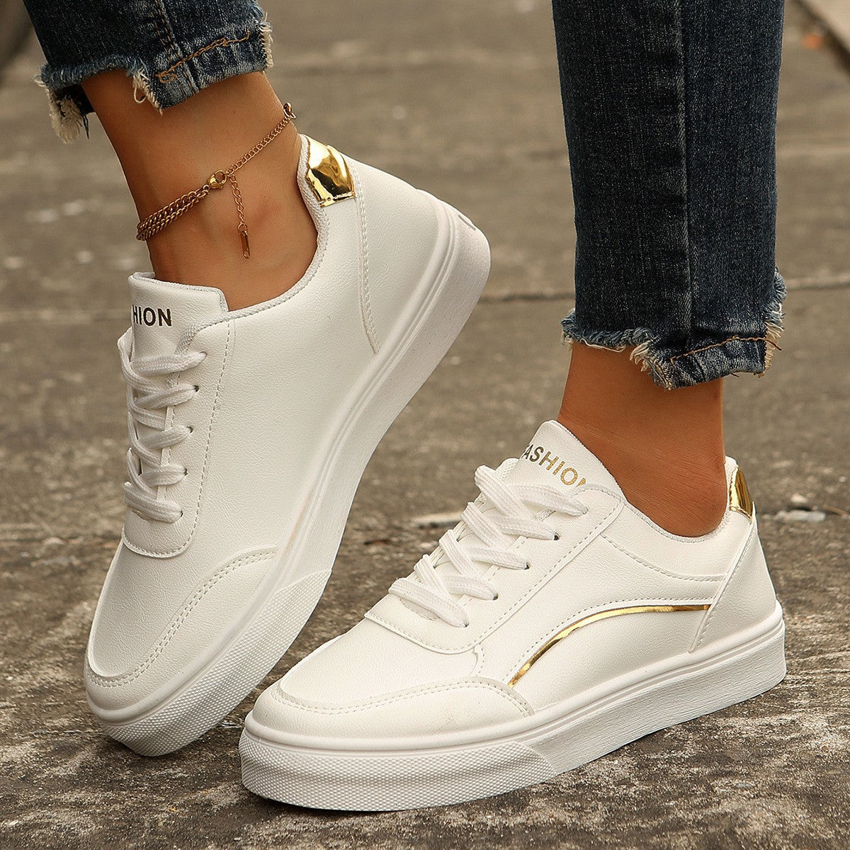 Women’s white round-toe flats with thick sole, casual lace-up style.