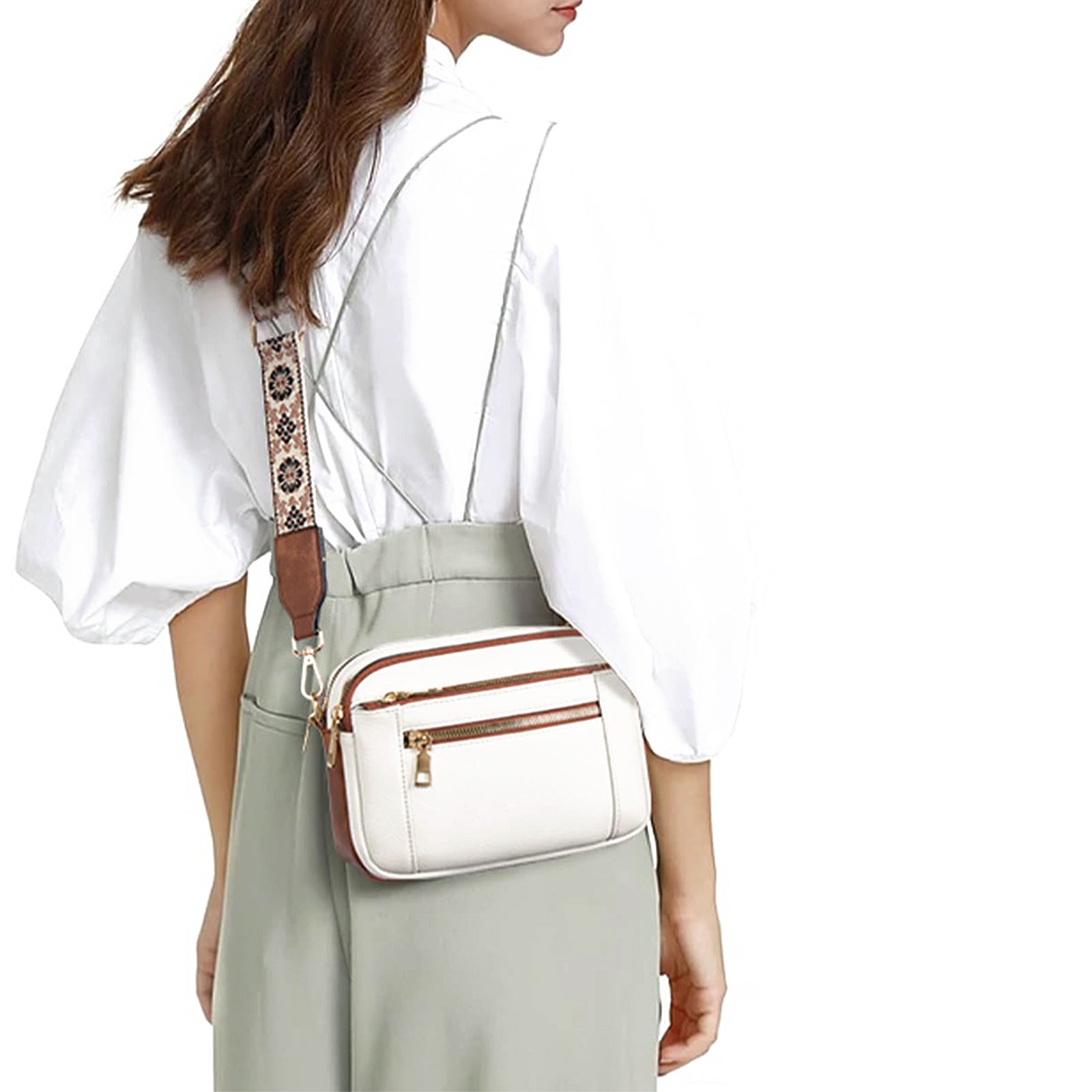 Women’s triple-zip colorblock crossbody bag with embroidered strap.