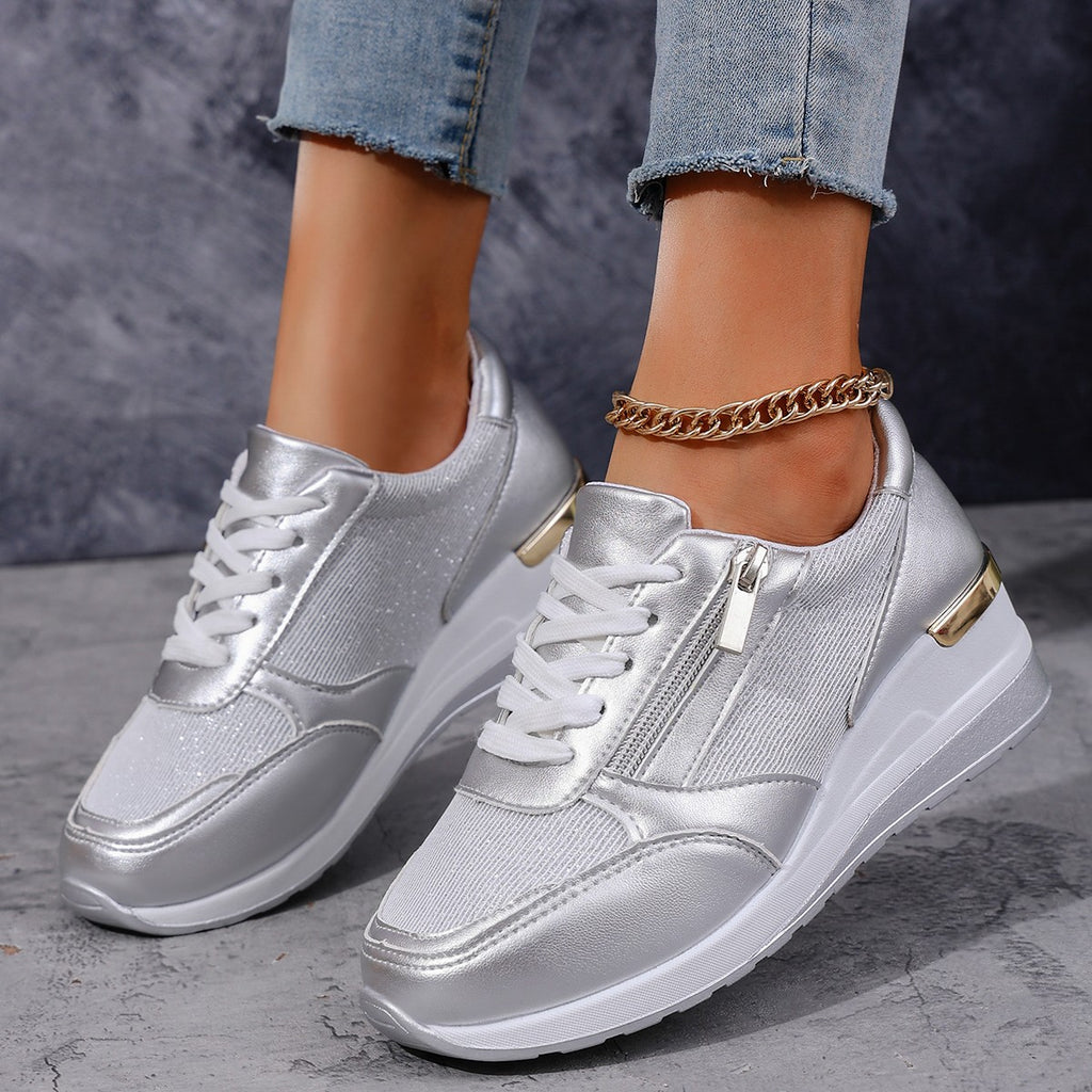 Women’s lace-up sneakers with side zipper and thick sole, casual sports style.