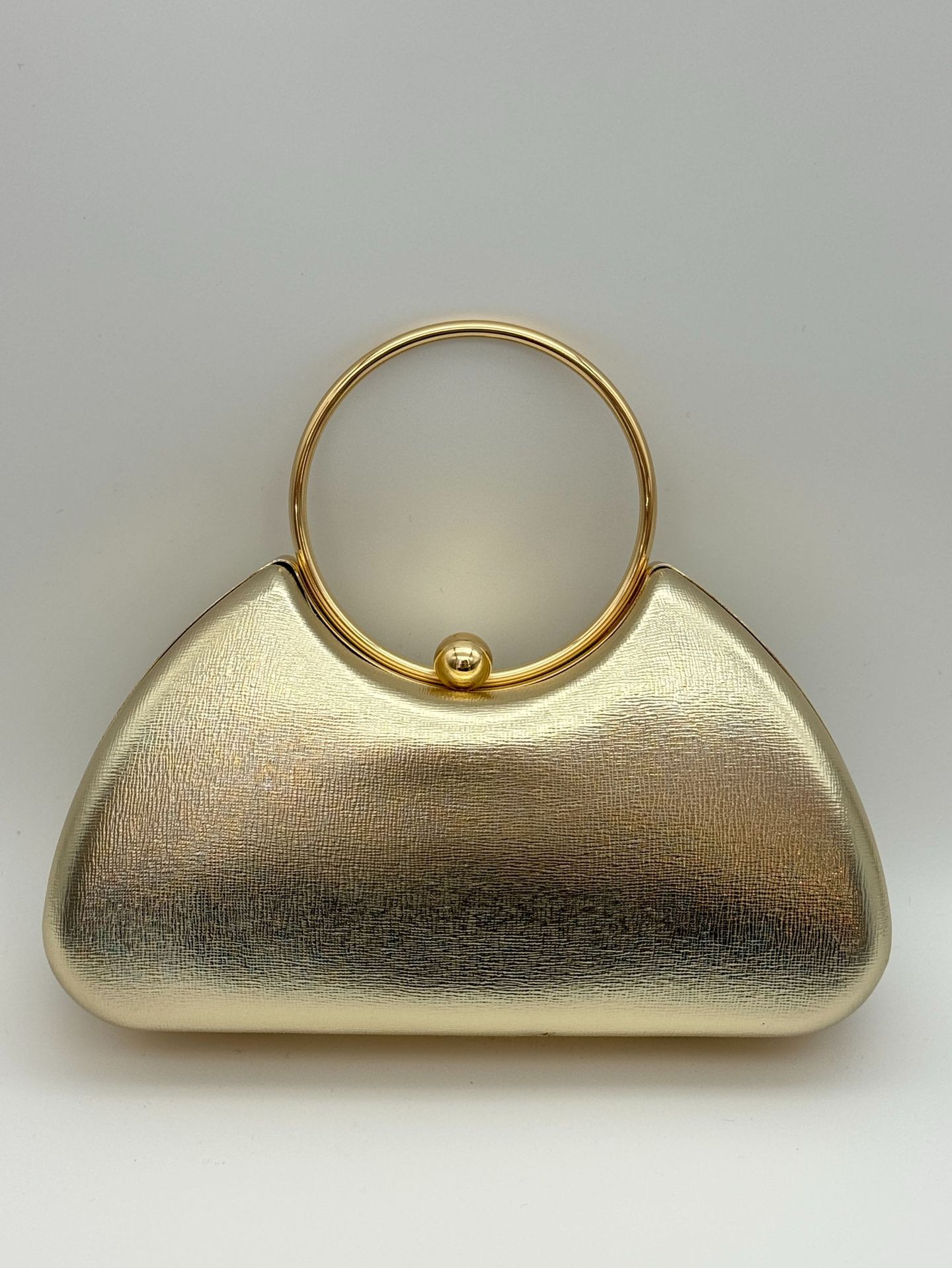 Women’s minimalist metal-frame evening clutch, perfect for parties.