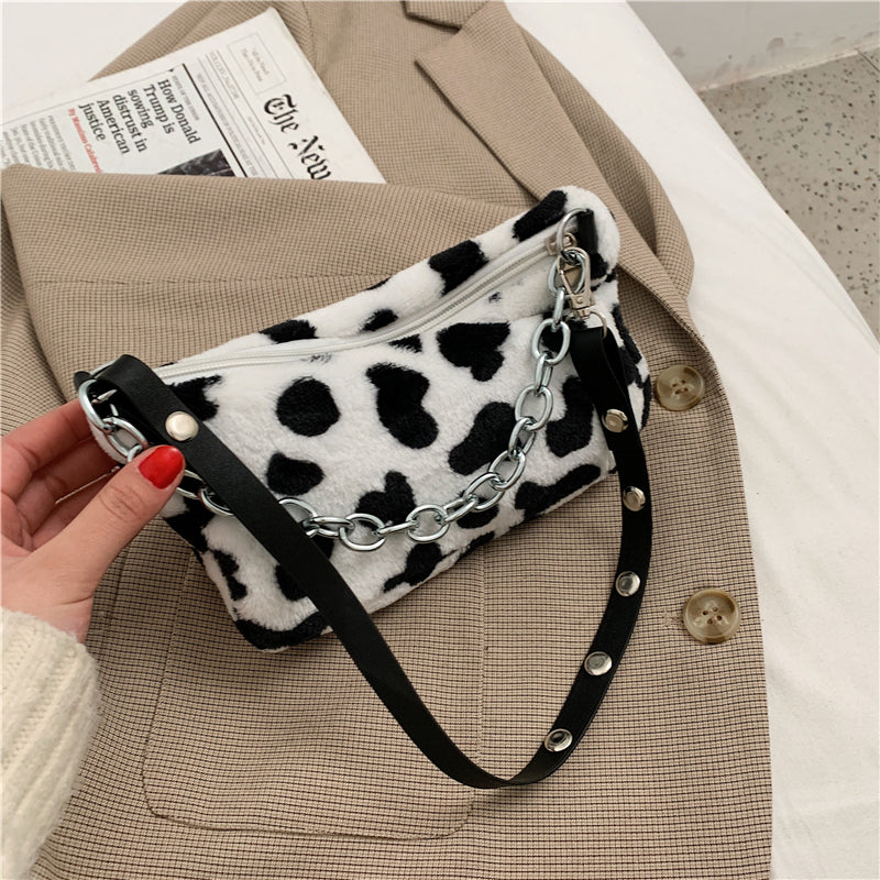 Women’s leopard print shoulder bag with chain strap.